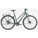 Trek District 3 Midstep hybrid bike for women, 2025 model, designed for urban commuting with a comfortable midstep frame.