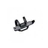Crankbrothers BC2 SOS Bottle Cage with integrated tyre repair tools in black and silver, mounted on a workshop workbench.