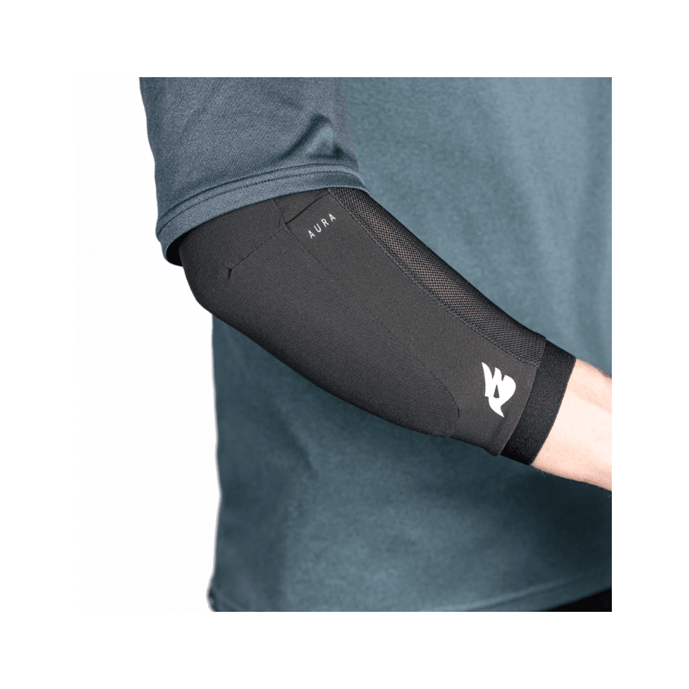 Bluegrass Aura Core Level 1 mountain bike elbow pads with Triple-Flex SAS-TEC protection, showing blue padded armor on elbows.