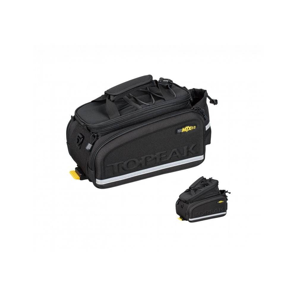 Topeak MTX TrunkBag DX 2.0 in black attached to bike rack, showing multiple compartments and reflective safety features.