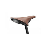 Brooks C17 Cambium all-weather bicycle saddle mounted on a bike, waterproof touring and commuter seat, durable and comfortable for riding.