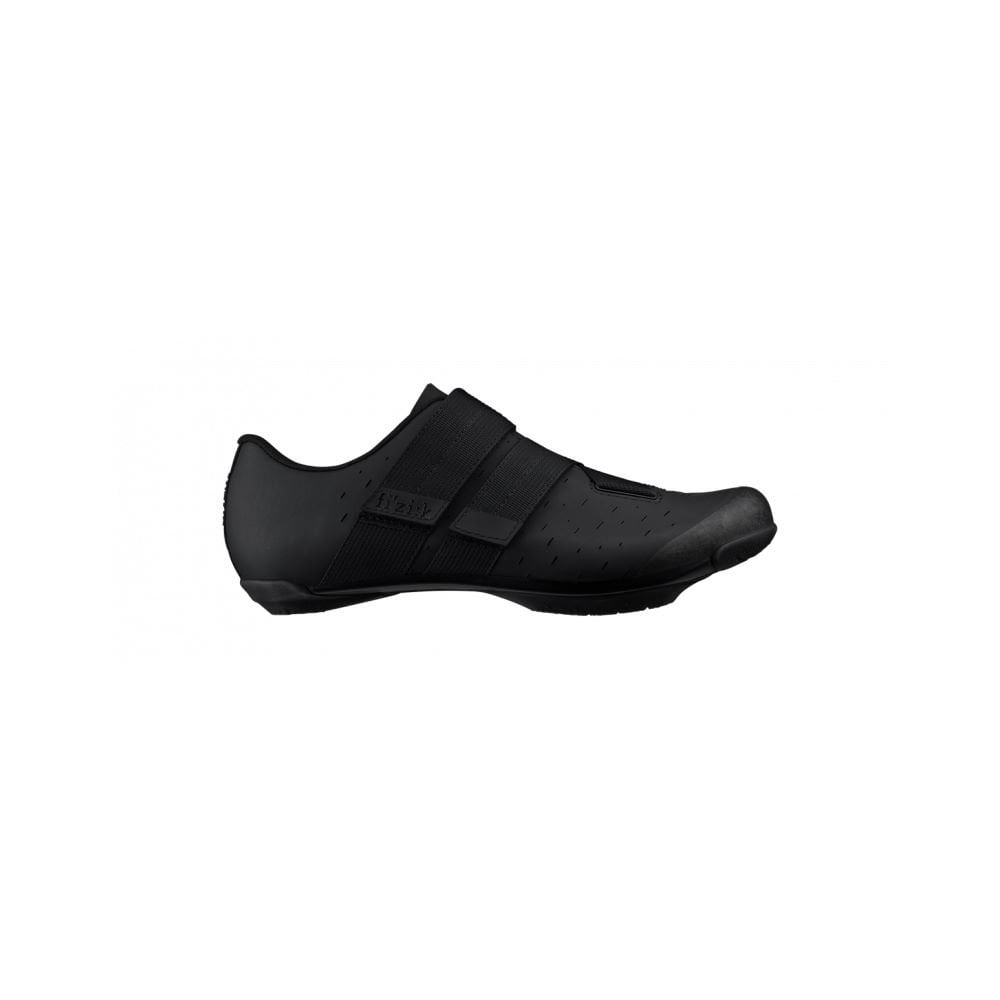 Fizik X4 Terra gravel cycling shoes with adjustable fit and durable outsole, shown in a close-up view focusing on the shoe's design.