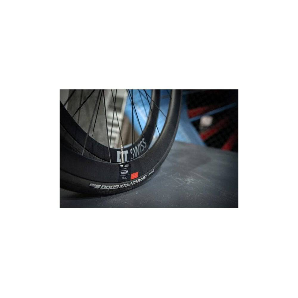 DT Swiss ARC 1100 DICUT rear disc brake wheel with carbon clincher rim, 38x20mm, shown with spokes and hub components.
