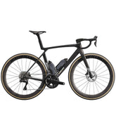 Trek Madone SLR 7 Gen 8 road bike with aero carbon frame and Shimano Ultegra Di2 shifters, positioned on a road.