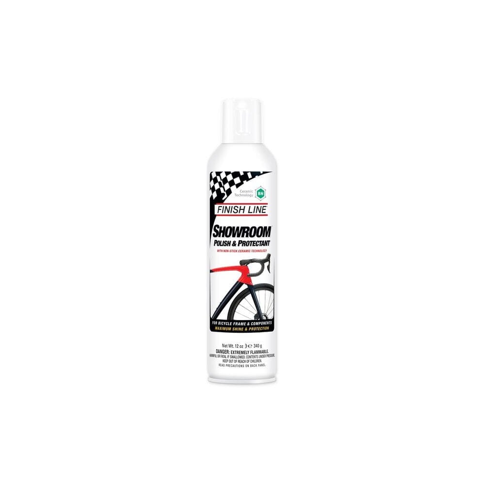 Finish Line Showroom Polish Ceramic Tech aerosol bike cleaner and protector in a workshop setting, displayed in a box of six.