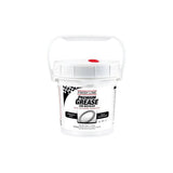 Finish Line Premium Ceramic Tech Grease tube for high-performance bike lubrication, shown in a workshop setting.