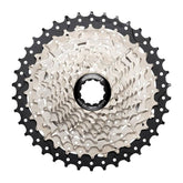 MicroSHIFT Microshift Sword G-Series 10-speed cassette with 11-38T gears for standard freehub wheels, shown on a bike wheel.