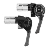 MicroSHIFT MT bar end shifters for mountain bike drop bars, with adjustable tension and index/friction mode, mounted on bike handlebars.