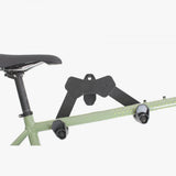 M Part wall-mounted horizontal bike rack with adjustable hooks and extension arm for secure bike storage.