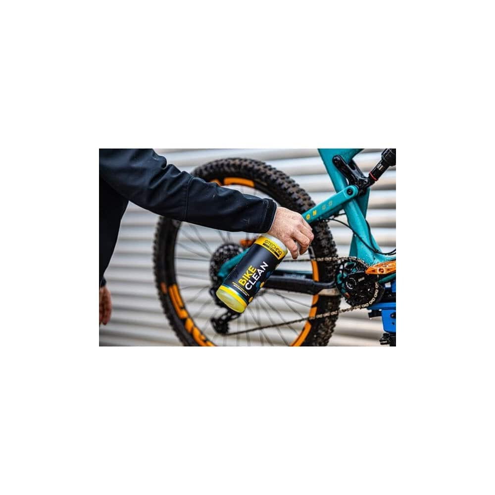 Gtechniq Bike Clean Premium bicycle cleaner with smart surface technology, shown in a workshop setting.