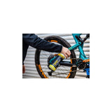 Gtechniq Bike Clean Premium bicycle cleaner with smart surface technology, shown in a workshop setting.