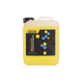Gtechniq Bike Clean Concentrate eco-friendly bike cleaner in a workshop setting, showing the bottle and cleaning tools.