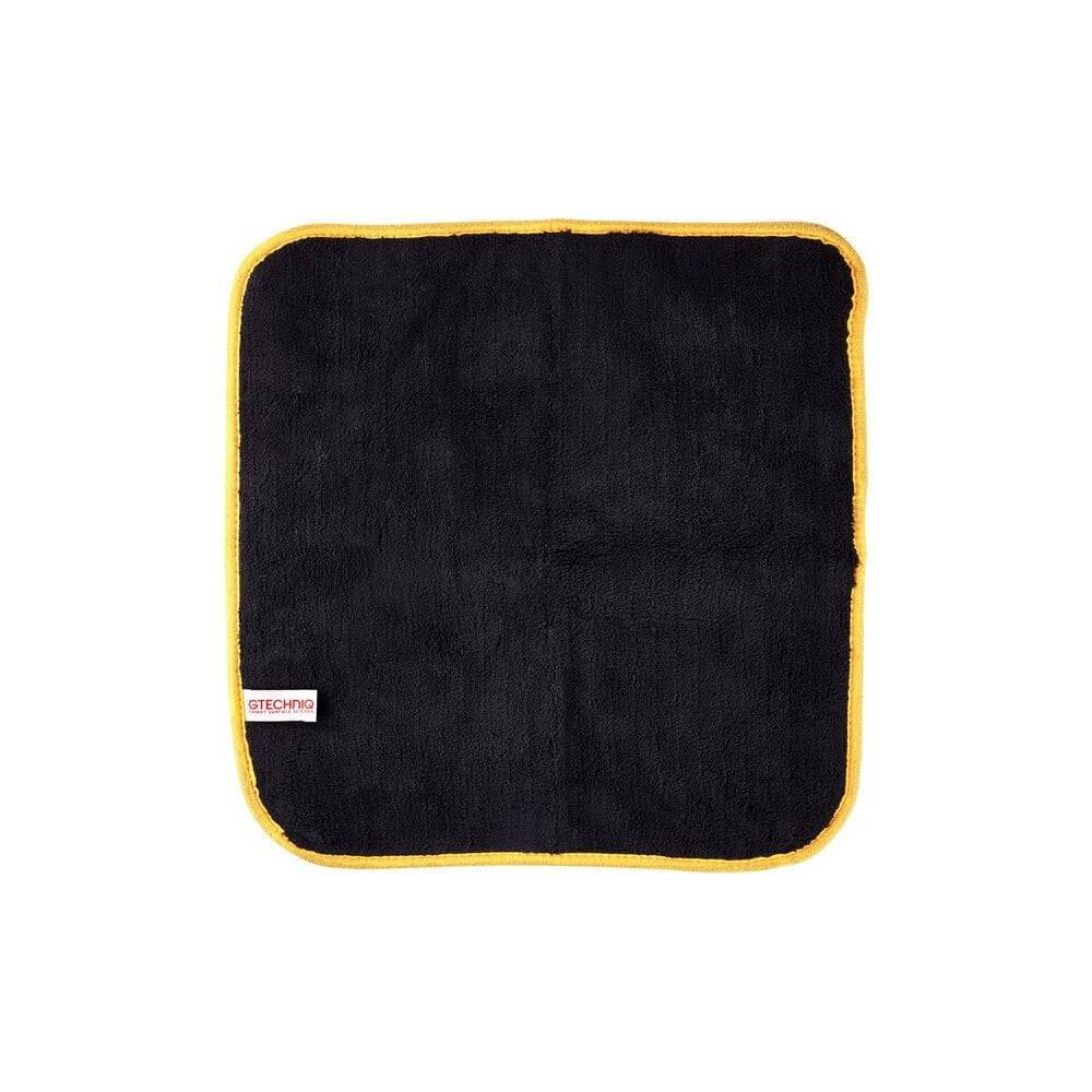 Gtechniq Bike Drying Towel, ultra-absorbent microfiber for scratch-free motorcycle drying, shown hanging on a workshop hook