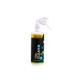 Gtechniq Bike Tri-Clean 500ml antibacterial cleaner for cycling gear and helmets, shown in a workshop setting.