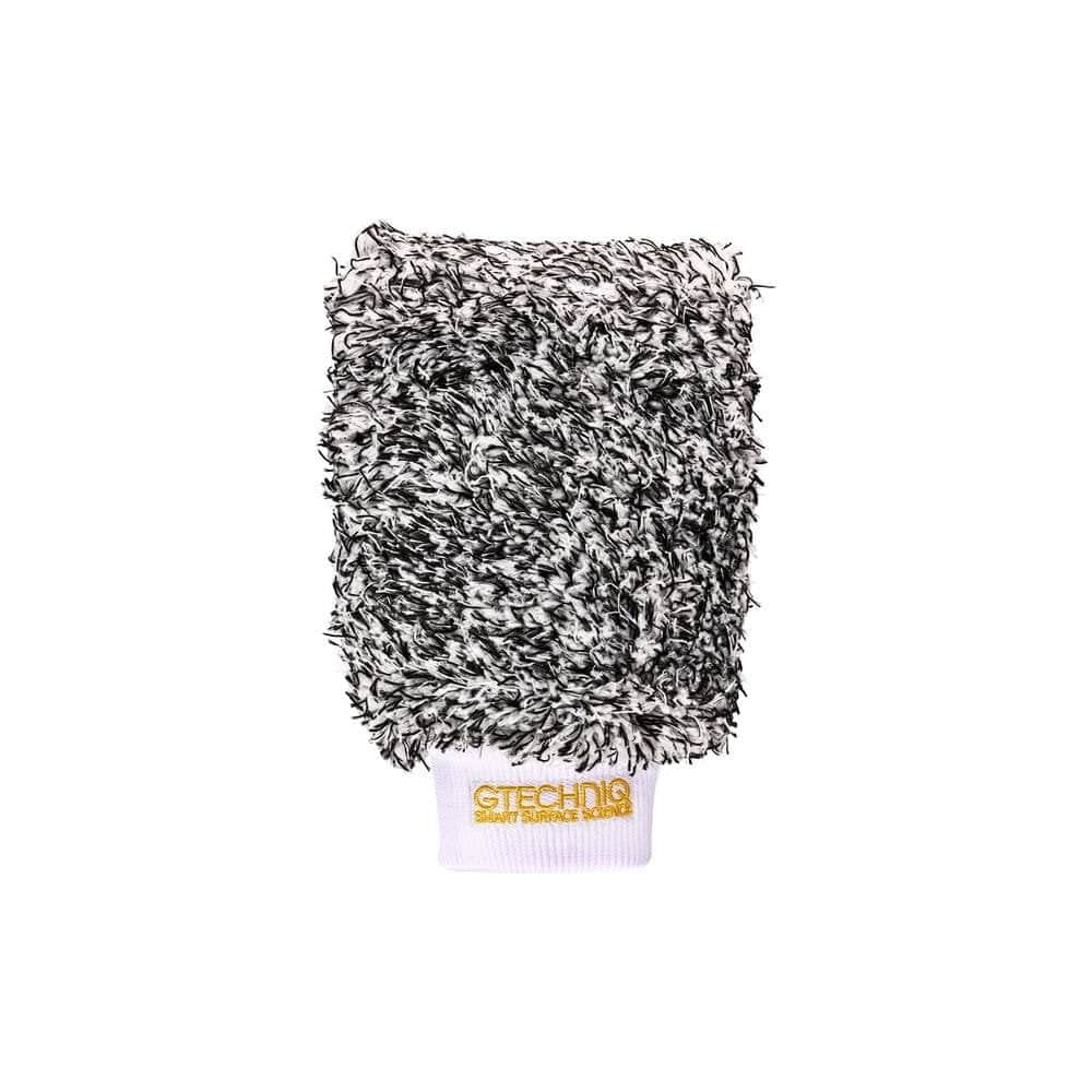 Gtechniq Bike Microfibre Wash Mitt for scratch-free bike cleaning and care, showing a soft, white microfiber mitt in a workshop setting.