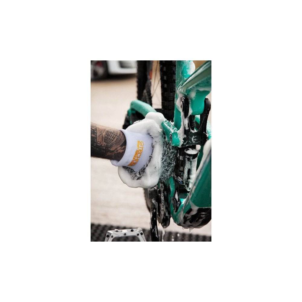 Gtechniq Bike Microfibre Wash Mitt for scratch-free bike cleaning, soft microfiber material, workshop setting, close-up view