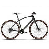 Trek FX Sport 5 hybrid bike featuring SRAM Apex drivetrain and hydraulic disc brakes, front view with black frame and ergonomic handlebars.