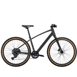 Trek Dual Sport 2 hybrid bike with Shimano 9-speed gears and hydraulic disc brakes, shown with a sleek frame and knobby tires.
