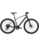 Trek Dual Sport 2 hybrid bike with Shimano 9-speed gears and hydraulic disc brakes, suitable for urban and off-road riding.