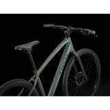 Trek Dual Sport 2 hybrid bike with Shimano 9-speed and hydraulic disc brakes, featuring a sleek frame and versatile tires.