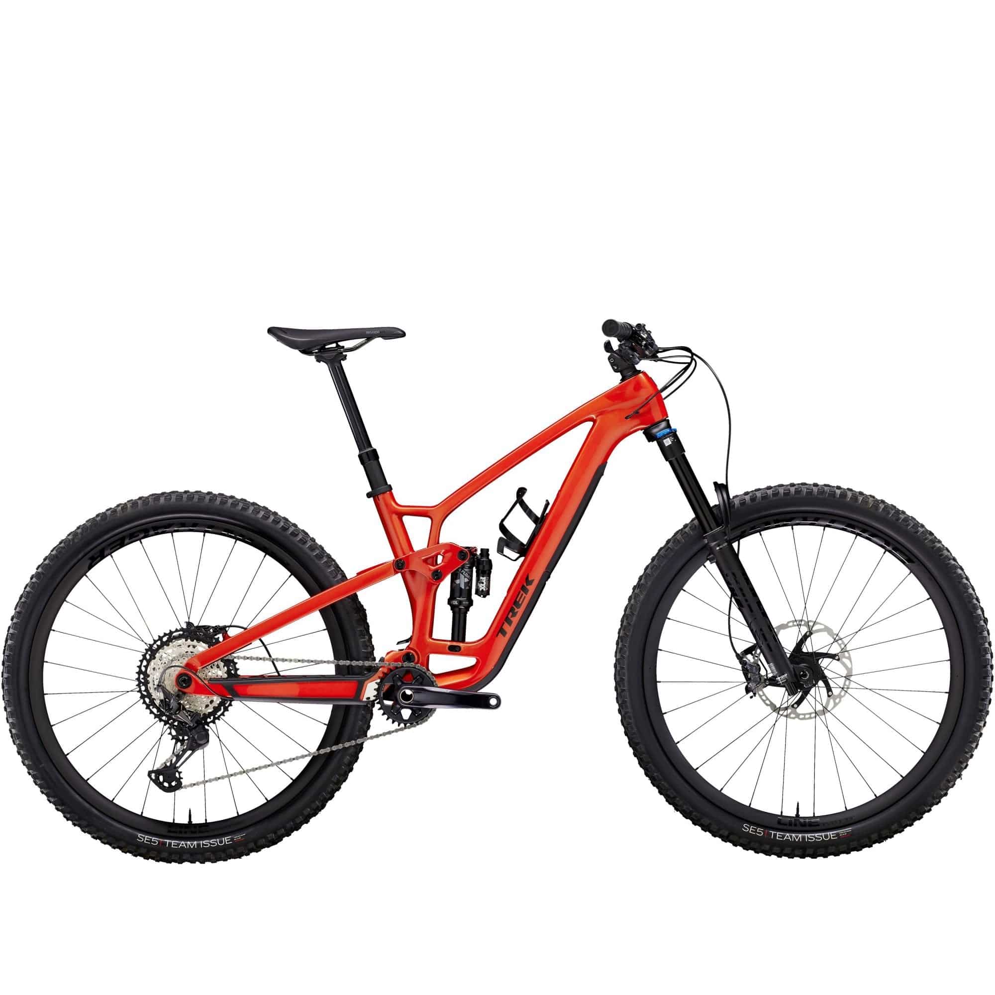 Trek Fuel EX 9.8 XT mountain bike with carbon frame and Shimano Deore XT drivetrain, shown on rugged trail.
