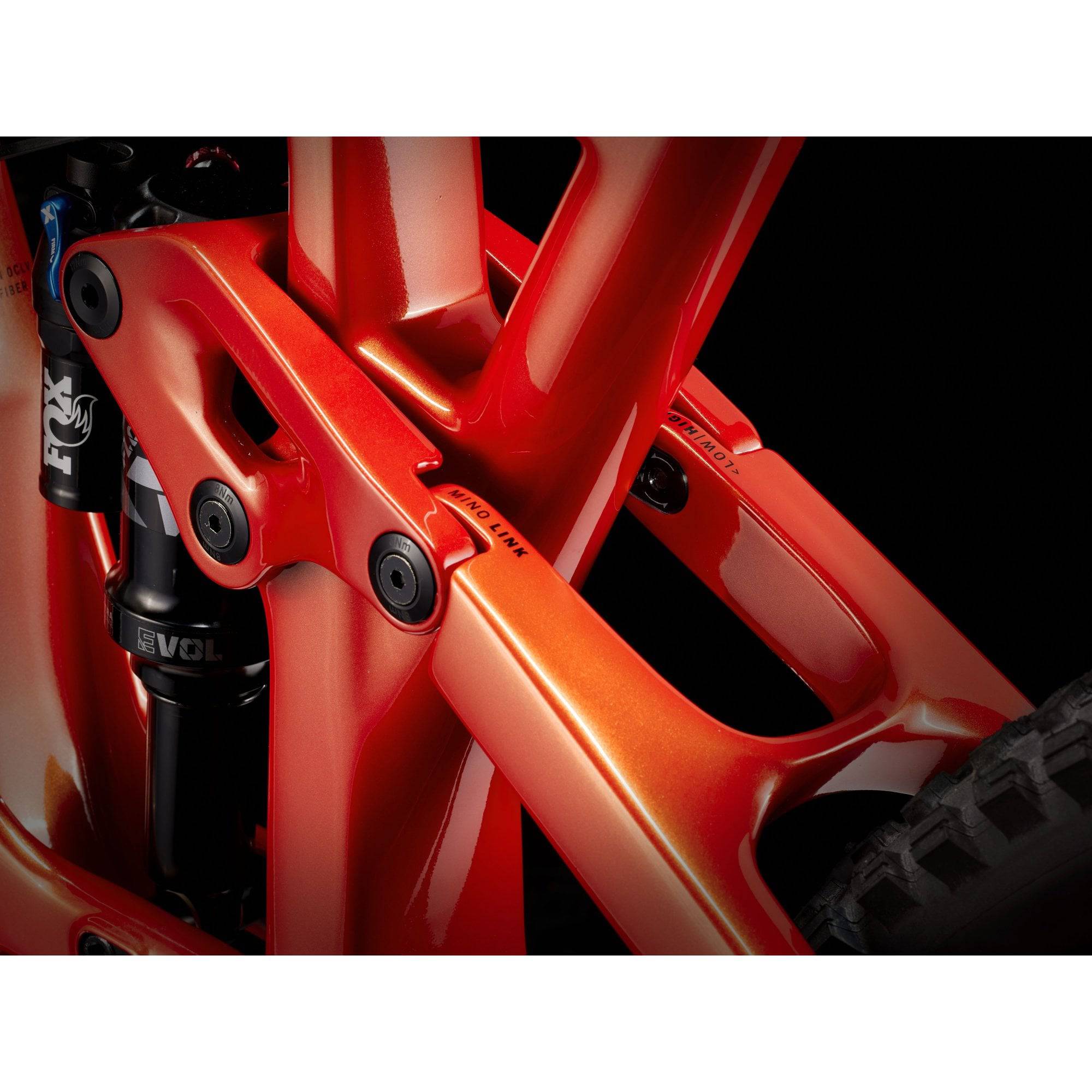 Trek Fuel EX 9.8 XT mountain bike with carbon frame and Shimano Deore XT drivetrain, shown on trail with suspension and knobby tires.