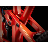 Trek Fuel EX 9.8 XT mountain bike with carbon frame and Shimano Deore XT drivetrain, shown on trail with suspension and knobby tires.