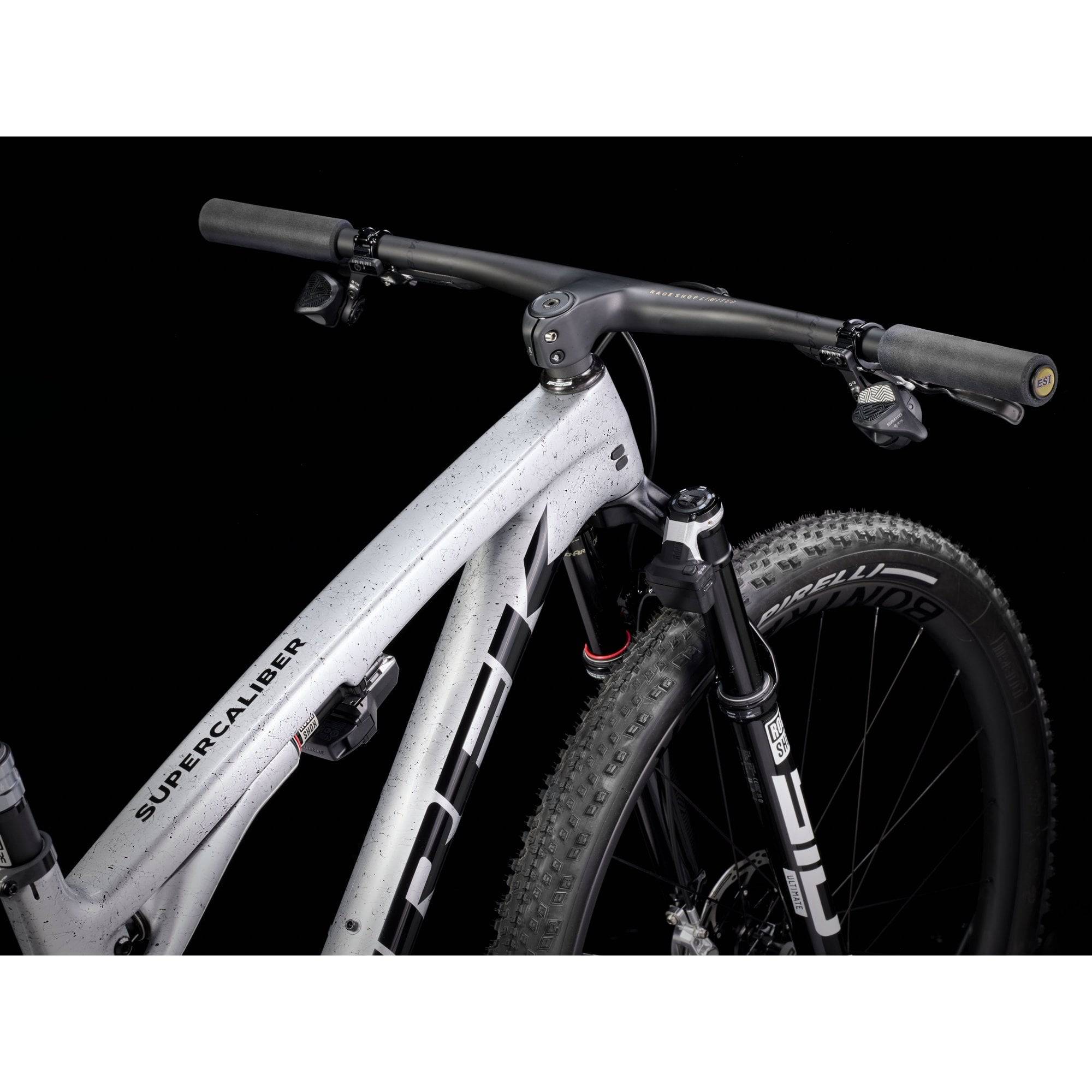Trek Supercaliber SLR 9.9 Flight Attendant Gen 2 mountain bike for XC racing, featuring lightweight frame and advanced suspension.