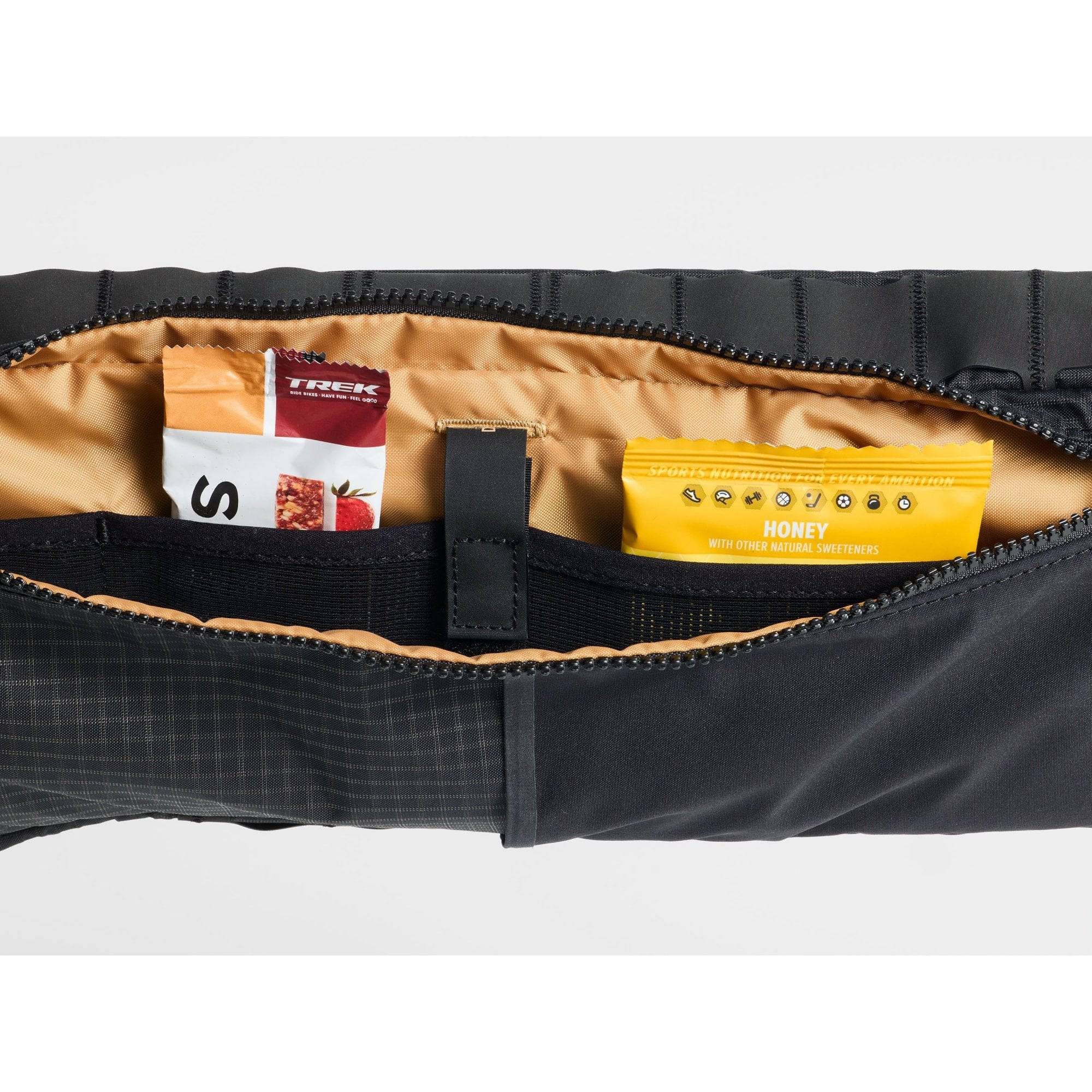 Trek bike packing adventure frame bag attached to a bicycle frame, durable cycling storage accessory for long-distance rides.