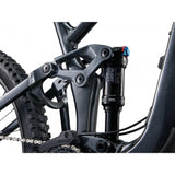 Liv Intrigue X 1 mountain bike with 29-inch wheels, adjustable geometry, and suspension, shown in a natural outdoor setting.