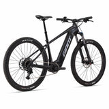 Giant Fathom E+ 2 e-mountain bike with 75Nm torque and 625Wh battery, shown outdoors on rugged trail.