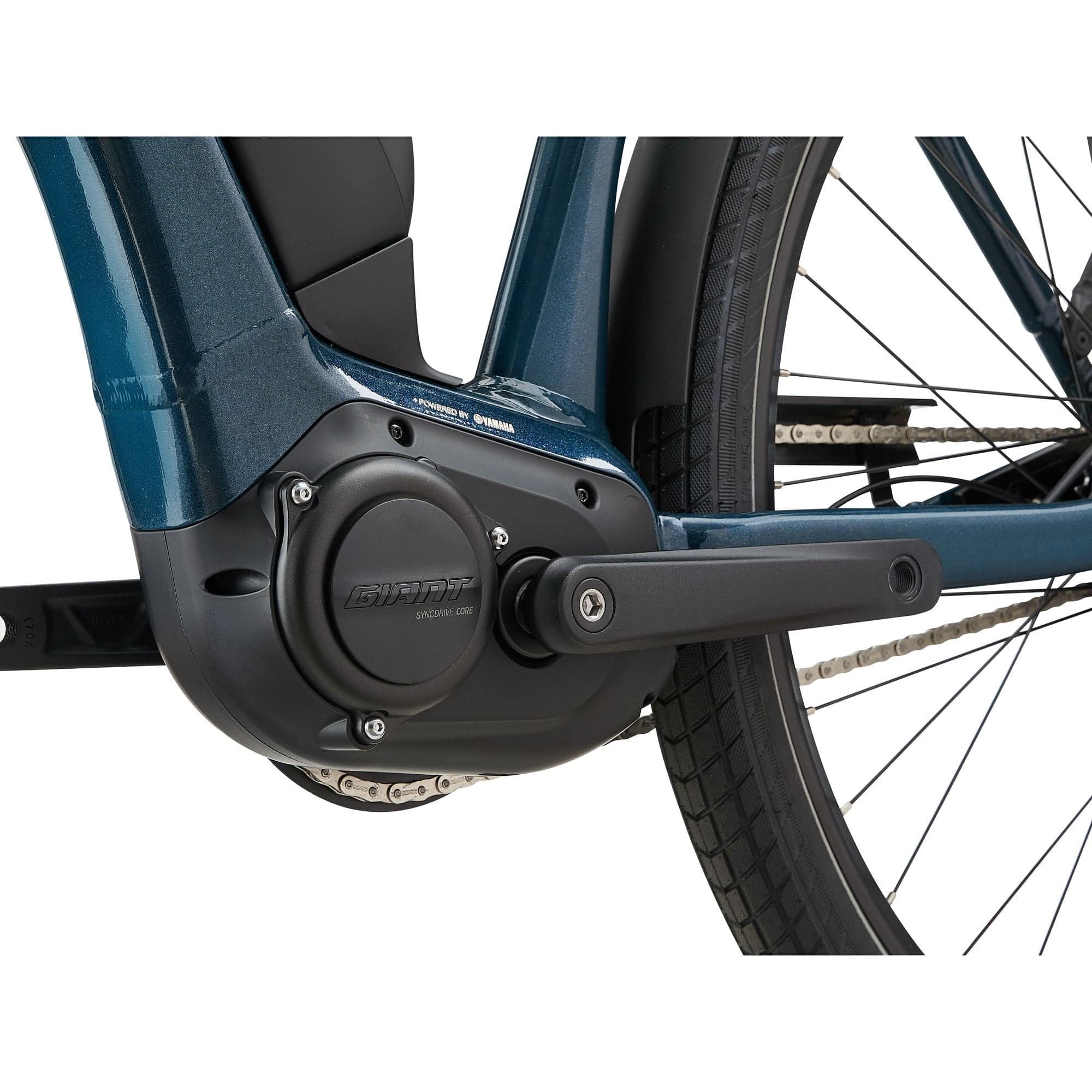 Giant EXPRESSION E+ 1 e-hybrid bike with SyncDrive Core motor and Shimano Nexus gear shifter, parked outdoors.