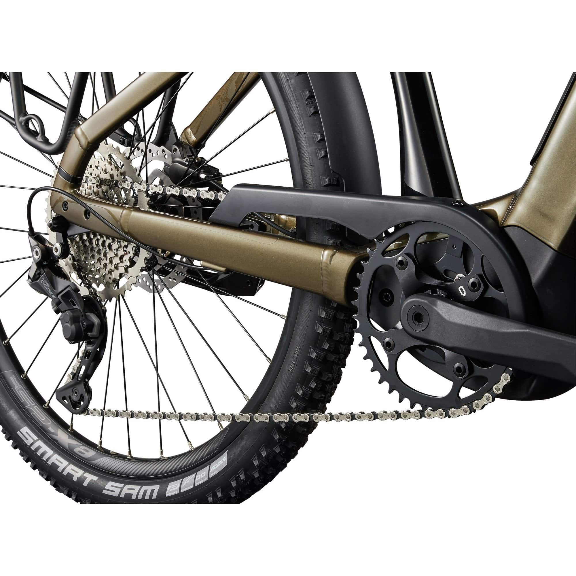Giant AnyTour X E+ 3 e-Hybrid bike with SyncDrive motor, integrated Ride Dash Evo navigation, and 25km/h speed in a natural outdoor setting.