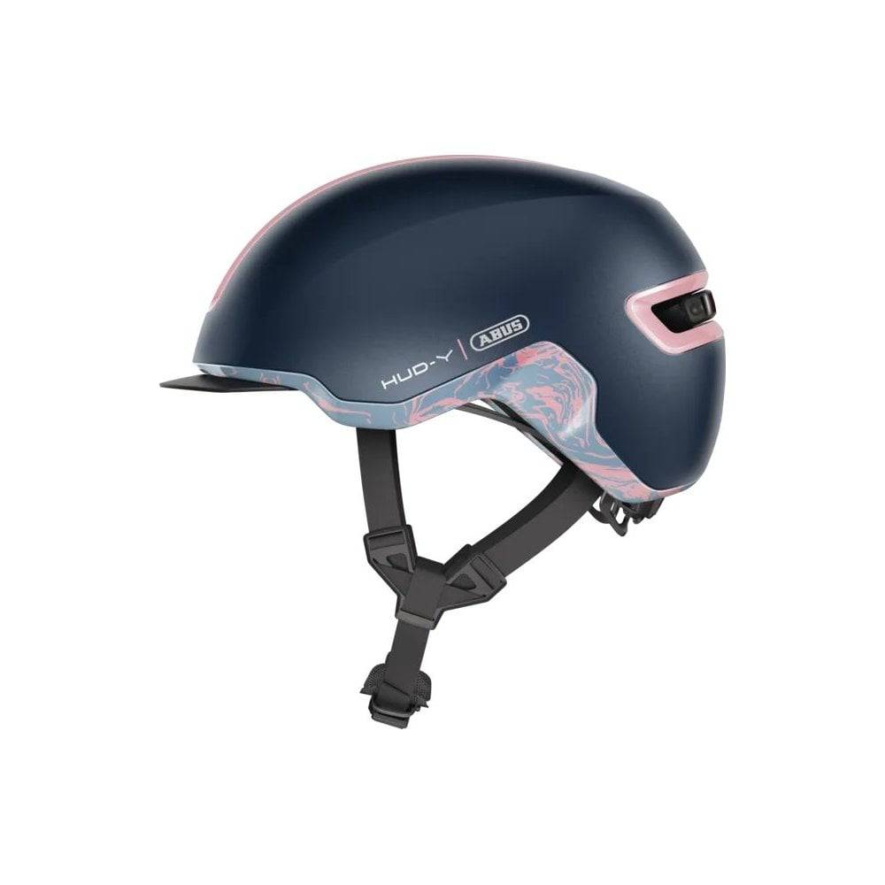 ABUS HUD-Y urban cycling helmet with rechargeable rear LED light, designed for city bike commuting and safety.