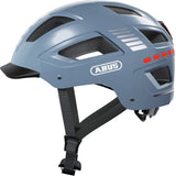ABUS Hyban 2.0 urban cycling helmet with ventilation and adjustable fit, shown from the side with vents and strap details.