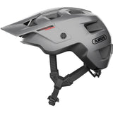 ABUS MODROP mountain bike helmet with adjustable visor and secure fit system, shown from front angle on a neutral background.