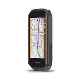 Garmin Edge 1050 GPS bike computer with screen displaying navigation maps and performance metrics for cycling.