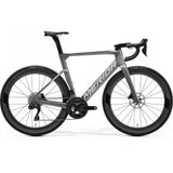 Merida Reacto 6000 road bike featuring Shimano 105 Di2 electronic shifting and disc brakes, with a sleek aerodynamic frame.