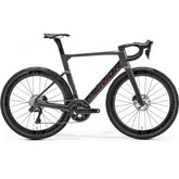 Merida Reacto 9000 Aero Road Bike with hydraulic disc brakes and wide tire compatibility, featuring a sleek aerodynamic frame.