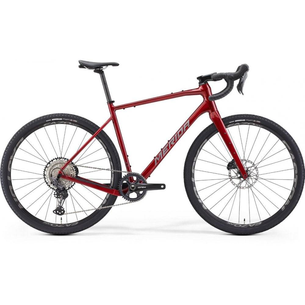 Merida Silex 700 gravel bike with hydraulic disc brakes and MTB-inspired geometry, shown with sleek frame and knobby tires.