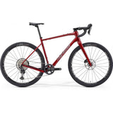 Merida Silex 700 gravel bike with hydraulic disc brakes and MTB-inspired geometry, shown with sleek frame and knobby tires.