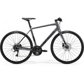Merida Speeder 100 hybrid bike with Shimano Acera components and hydraulic disc brakes, black and silver frame.