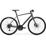 Merida Speeder 100 hybrid bike with Shimano Acera components and hydraulic disc brakes, black and silver frame.