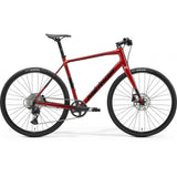 Merida Speeder 500 hybrid bike with hydraulic disc brakes and SRAM Apex XLPR groupset, featuring a sleek frame and mountain bike tires.
