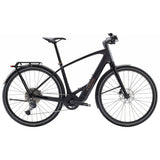 Trek FX+ 7 2025 e-hybrid bike with Shimano CUES U6000 system and disc brakes, shown from side view on a city street.