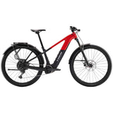 Trek Powerfly+ 4 EQ electric mountain bike with 29-inch wheels and Gen 5 motor, shown in profile on rugged trail.