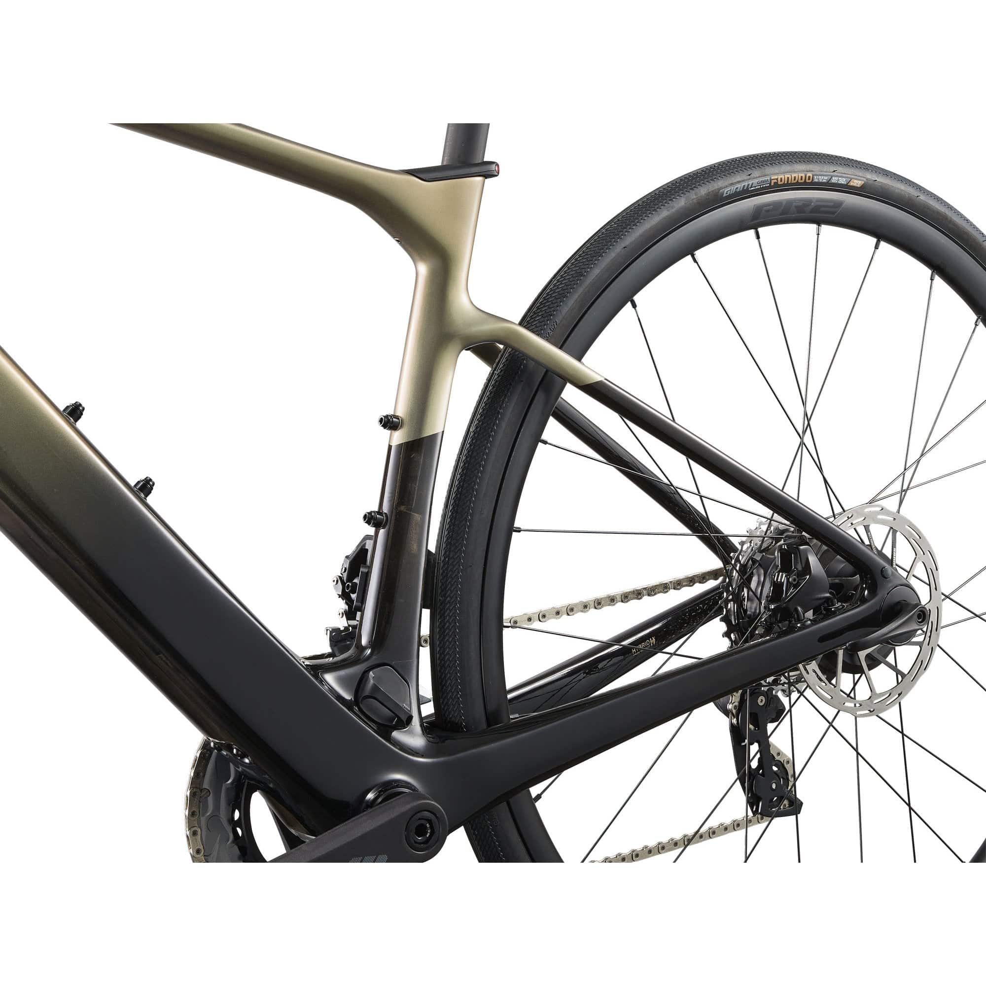 Liv Avail Advanced E+ Elite 2 women's e-road bike with SyncDrive motor and SRAM Rival AXS shifters in a scenic outdoor setting.