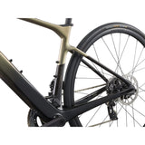 Liv Avail Advanced E+ Elite 2 women's e-road bike with SyncDrive motor and SRAM Rival AXS shifters in a scenic outdoor setting.