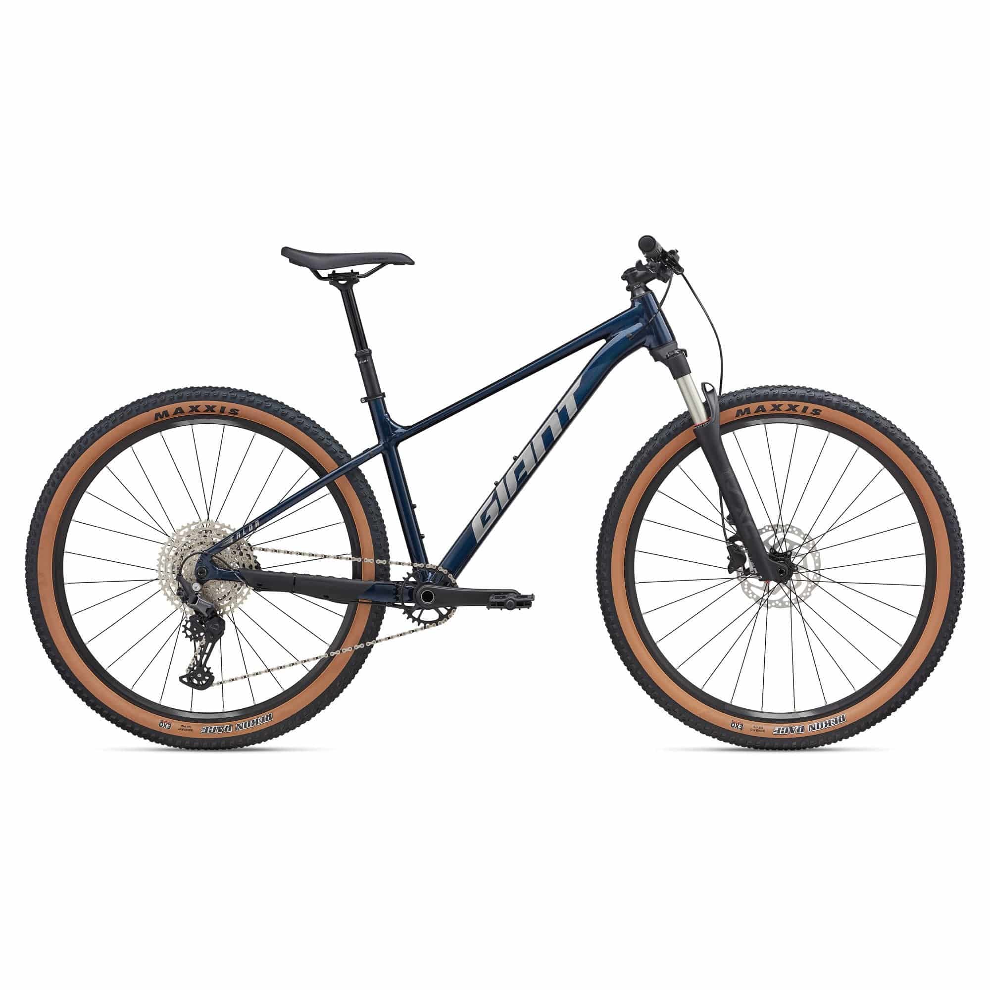 Giant Talon 29 0 mountain bike with Shimano Deore M6100 drivetrain and disc brakes, shown on rugged trail terrain.