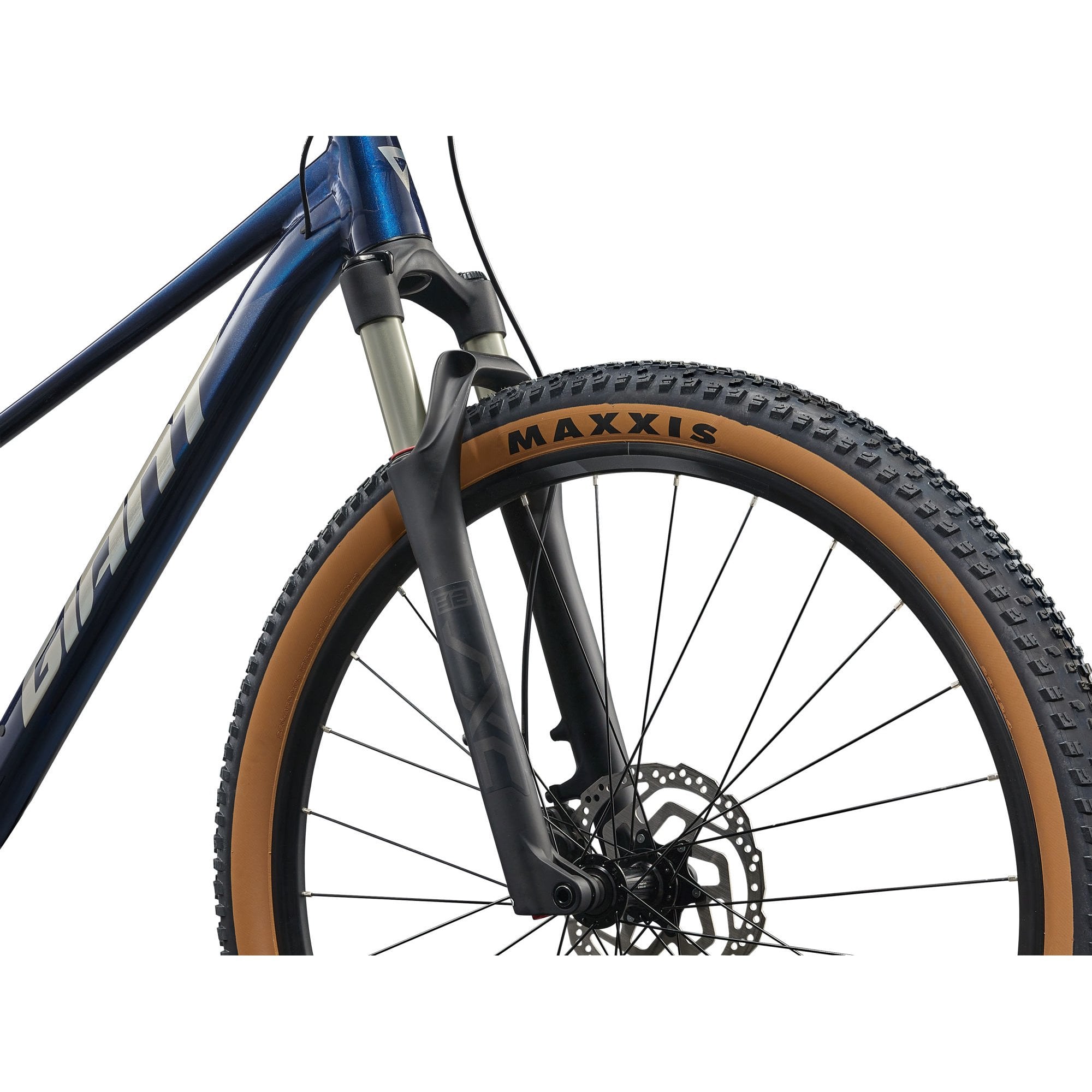Giant Talon 29 0 mountain bike with Shimano Deore M6100 drivetrain and disc brakes, shown on rugged trail terrain.